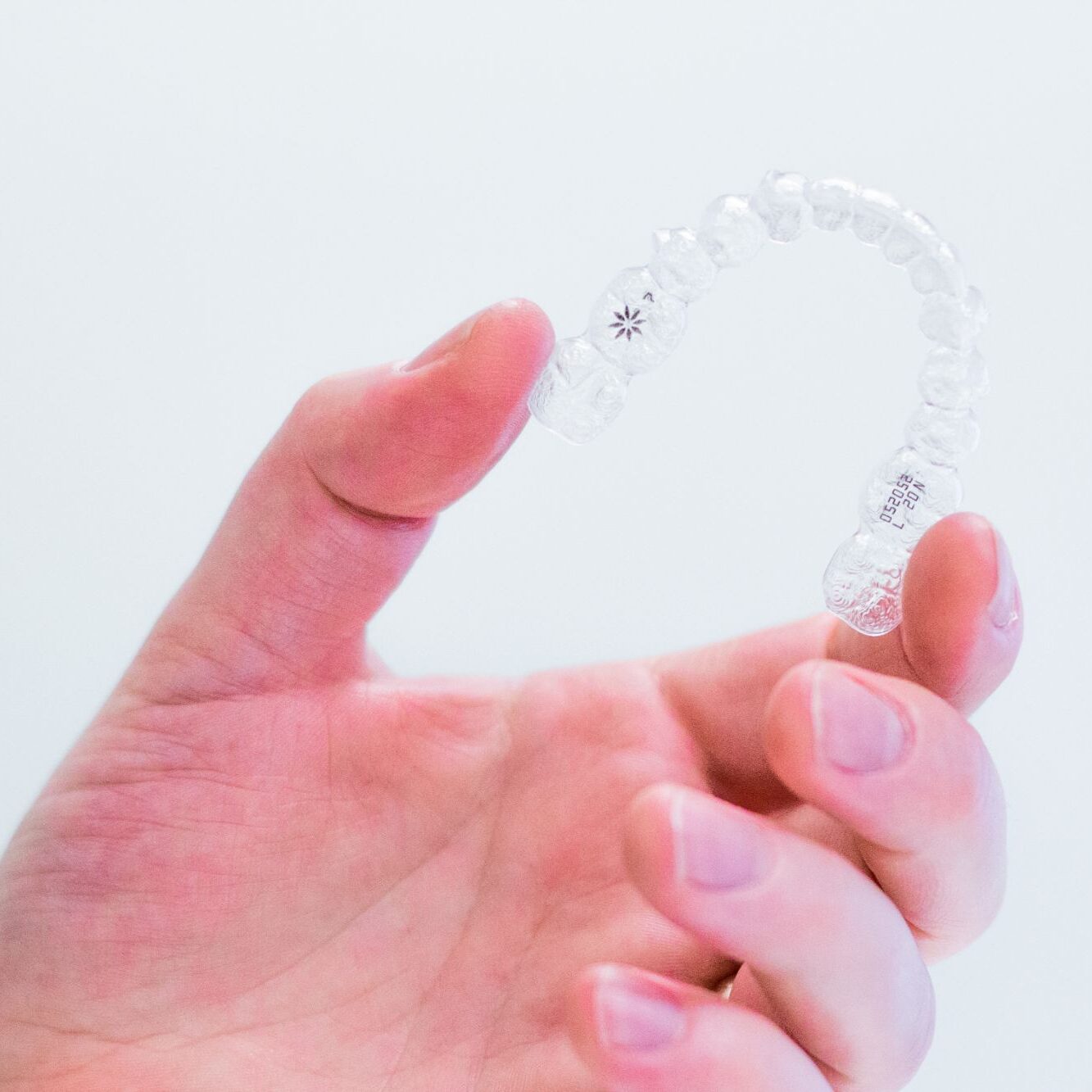 hand-holding-invisalign-aligners orthodontics citrus heights